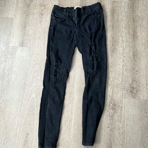 women’s black ripped jeans